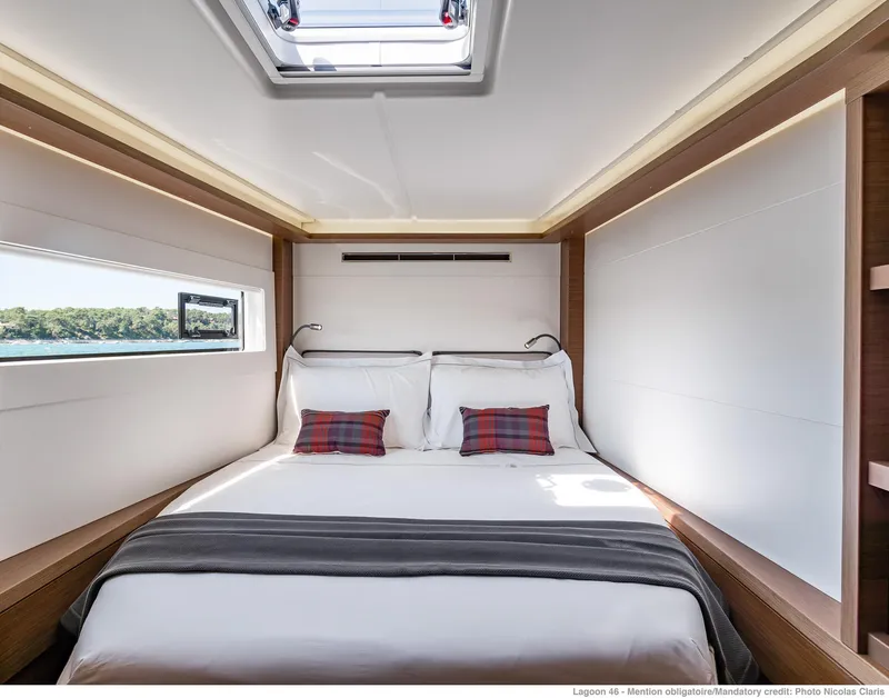Slide: The Image of Luxurious bedroom interior of 2025 Lagoon 46 ICONIC yacht with modern design and natural light. - 14