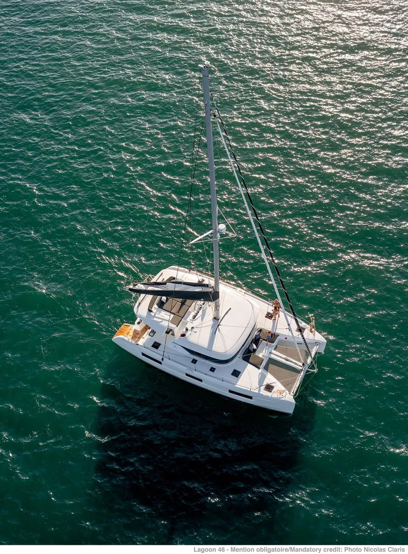 Slide: The Image of Aerial view of 2025 Lagoon 46 ICONIC catamaran sailing on open sea. - 3