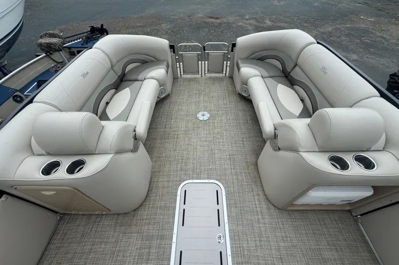 Slide: The Image of 2017 JC 23 Neptoon TT Sport pontoon boat interior with plush seating and cup holders. - 13