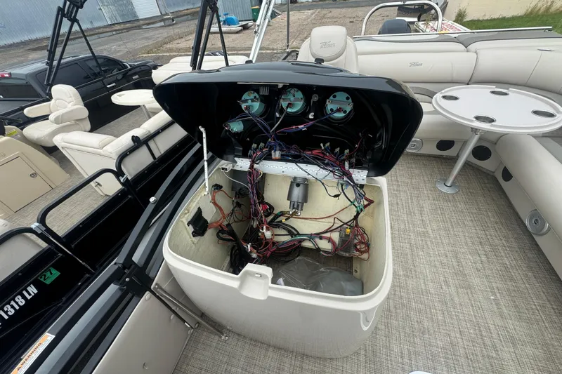 Slide: The Image of 2017 JC 23 Neptoon TT Sport boat interior with open wiring compartment. - 14