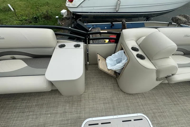Slide: The Image of Interior of 2017 JC 23 Neptoon TT Sport boat with beige seating and cup holders. - 16