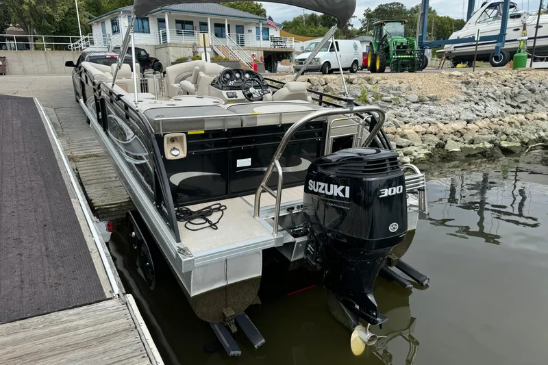 Slide: The Image of 2017 JC 23 Neptoon TT Sport pontoon boat with Suzuki 300 engine docked at marina. - 4
