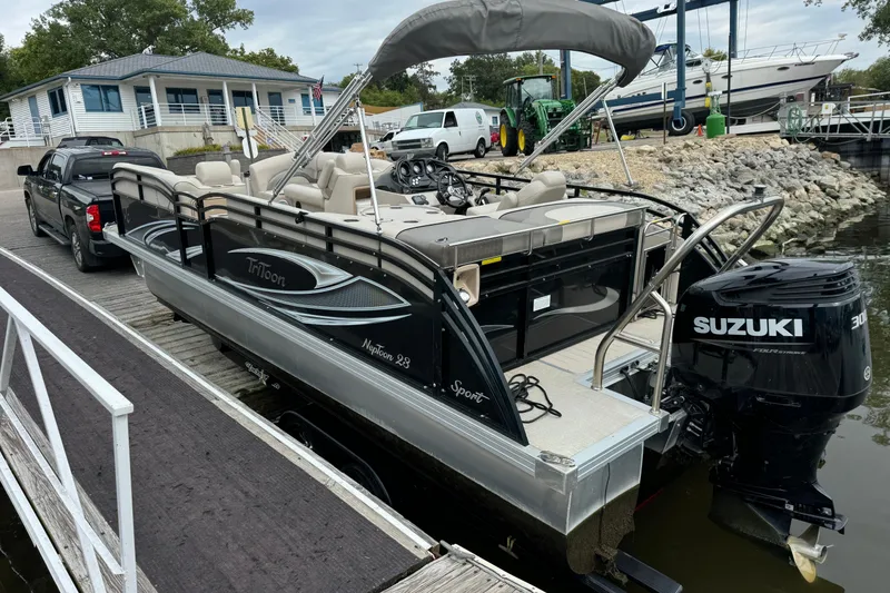 Slide: The Image of 2017 JC 23 Neptoon TT Sport pontoon boat with Suzuki engine at dock. - 5