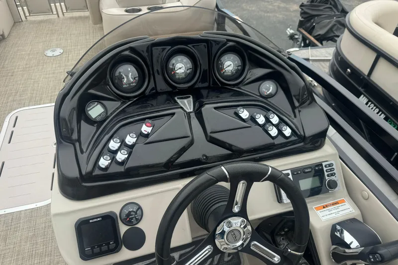 Slide: The Image of Dashboard of a 2017 JC 23 Neptoon TT Sport boat with steering wheel and controls. - 6