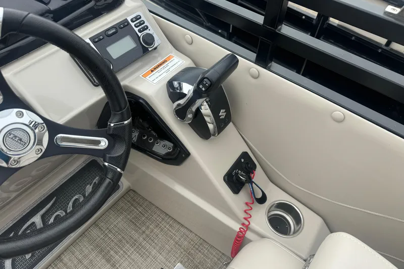 Slide: The Image of 2017 JC 23 Neptoon TT Sport boat dashboard with steering wheel and controls. - 8