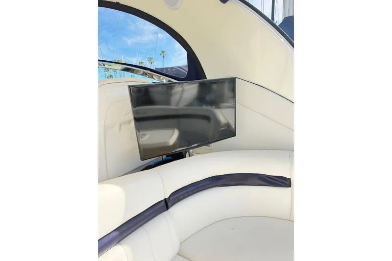Slide: The Image of Luxurious interior of 2008 Sea Ray 40 Sundancer with mounted TV and plush seating. - 10