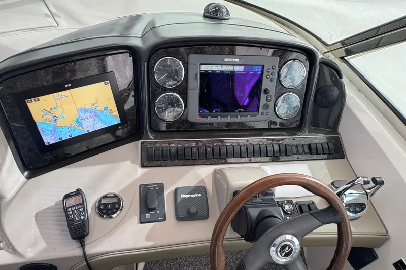 Slide: The Image of Helm of 2008 Sea Ray 40 Sundancer with navigation and control systems. - 14