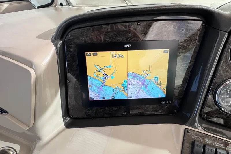 Slide: The Image of Dashboard of 2008 Sea Ray 40 Sundancer with navigation display. - 15