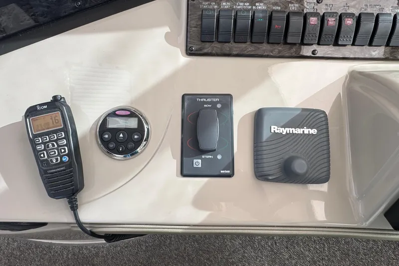 Slide: The Image of Control panel of a 2008 Sea Ray 40 Sundancer with communication and navigation equipment. - 18