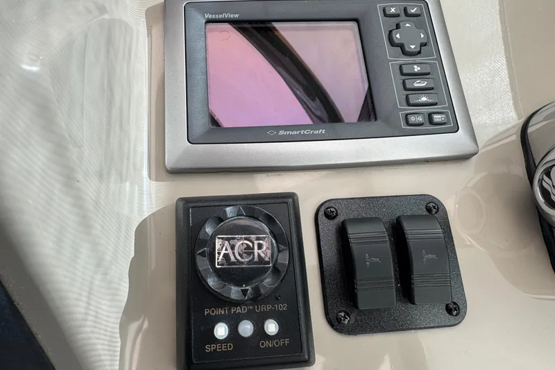 Slide: The Image of Control panel of a 2008 Sea Ray 40 Sundancer with SmartCraft display and ACR controls. - 23