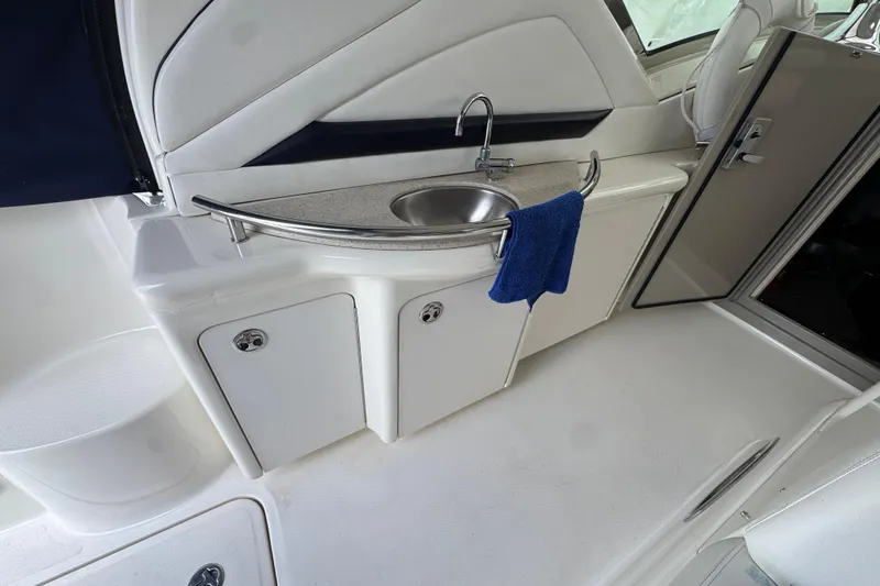 Slide: The Image of 2008 Sea Ray 40 Sundancer yacht interior with sink and storage cabinets. - 26