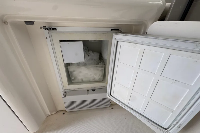 Slide: The Image of Open ice maker on 2008 Sea Ray 40 Sundancer yacht, filled with ice cubes. - 28