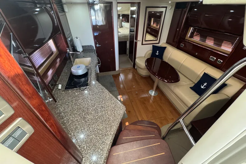 Slide: The Image of Luxurious interior of 2008 Sea Ray 40 Sundancer yacht with modern kitchen and seating area. - 32
