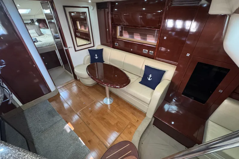 Slide: The Image of Luxurious 2008 Sea Ray 40 Sundancer yacht interior with elegant seating and wooden finishes. - 34