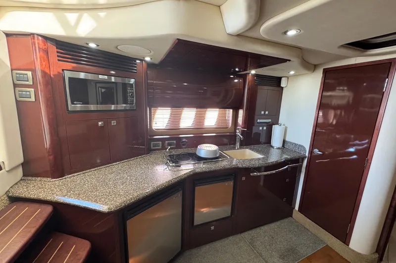 Slide: The Image of Luxurious 2008 Sea Ray 40 Sundancer yacht kitchen with modern amenities and sleek design. - 35