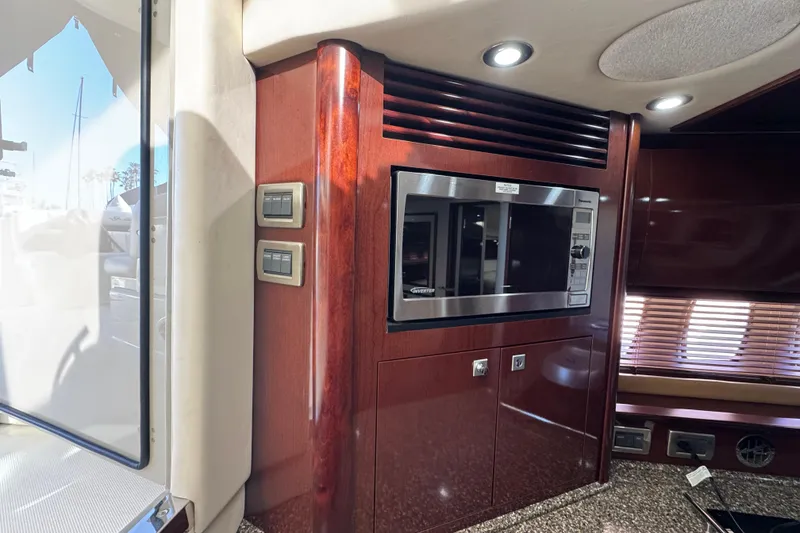 Slide: The Image of Interior of 2008 Sea Ray 40 Sundancer yacht with microwave and wood paneling. - 36