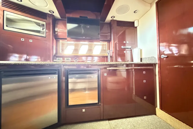 Slide: The Image of Luxurious 2008 Sea Ray 40 Sundancer yacht kitchen with modern appliances and sleek cabinetry. - 37