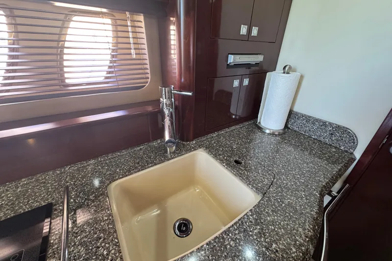 Slide: The Image of Luxurious kitchen area in 2008 Sea Ray 40 Sundancer yacht with granite countertop and sink. - 41