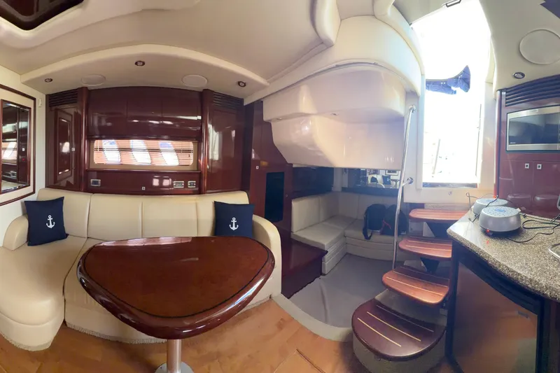 Slide: The Image of Luxurious interior of 2008 Sea Ray 40 Sundancer yacht with elegant seating and wooden accents. - 44