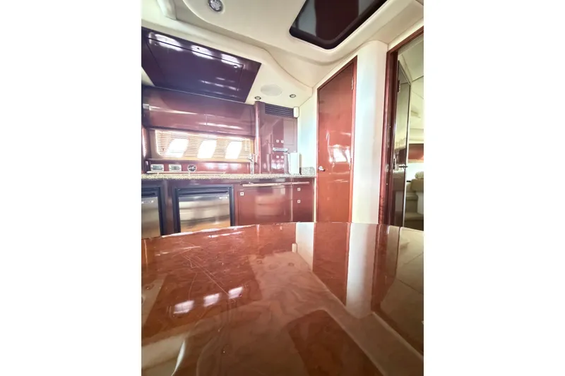 Slide: The Image of Luxurious interior of 2008 Sea Ray 40 Sundancer yacht with polished wood finishes. - 45