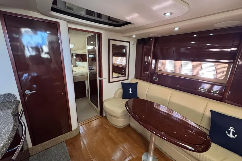 Slide: The Image of Luxurious interior of 2008 Sea Ray 40 Sundancer yacht with elegant seating and wooden finishes. - 49