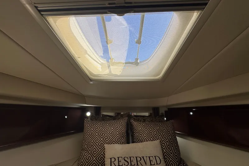 Slide: The Image of Interior cabin view of 2008 Sea Ray 40 Sundancer with skylight and decorative pillows. - 53