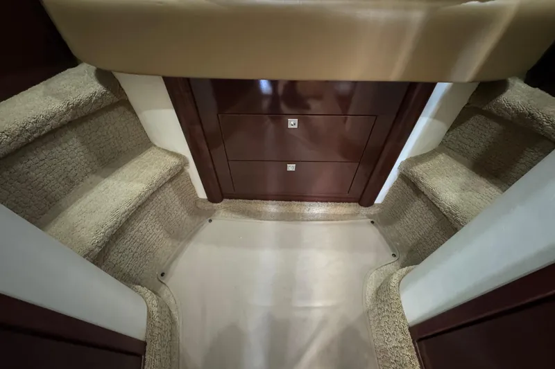 Slide: The Image of Interior stairs of 2008 Sea Ray 40 Sundancer yacht with carpeted steps and wooden cabinetry. - 57