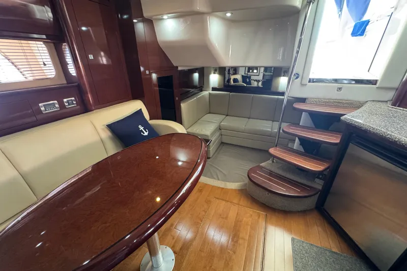 Slide: The Image of Luxurious interior of 2008 Sea Ray 40 Sundancer yacht with elegant seating and wooden finishes. - 64