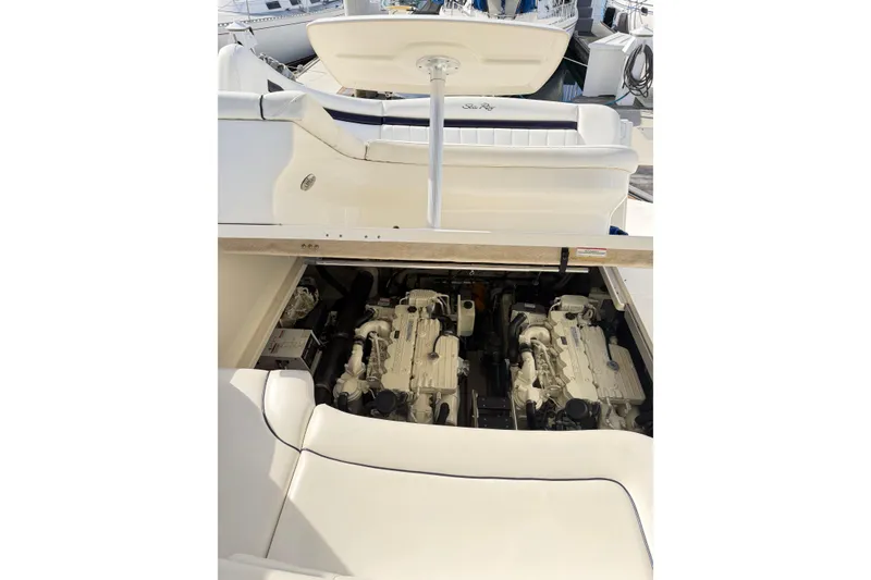 Slide: The Image of 2008 Sea Ray 40 Sundancer engine compartment with twin engines visible. - 65
