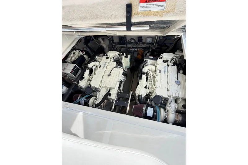 Slide: The Image of Engine compartment of 2008 Sea Ray 40 Sundancer, showcasing dual inboard engines. - 66