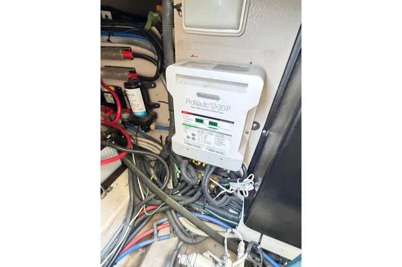 Slide: The Image of Electrical system inside a 2008 Sea Ray 40 Sundancer boat, featuring ProNautic charger. - 67