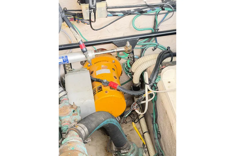 Slide: The Image of Engine room of 2008 Sea Ray 40 Sundancer with visible wiring and components. - 68