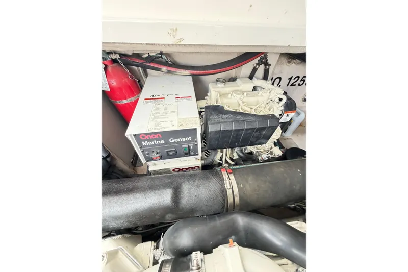 Slide: The Image of Engine compartment of 2008 Sea Ray 40 Sundancer with Onan Marine Genset. - 69