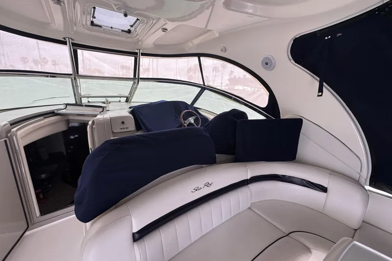 Slide: The Image of Interior of 2008 Sea Ray 40 Sundancer yacht with plush seating and helm. - 7