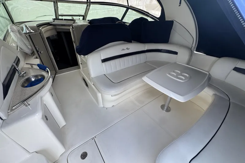 Slide: The Image of Interior of 2008 Sea Ray 40 Sundancer yacht with seating and table. - 8