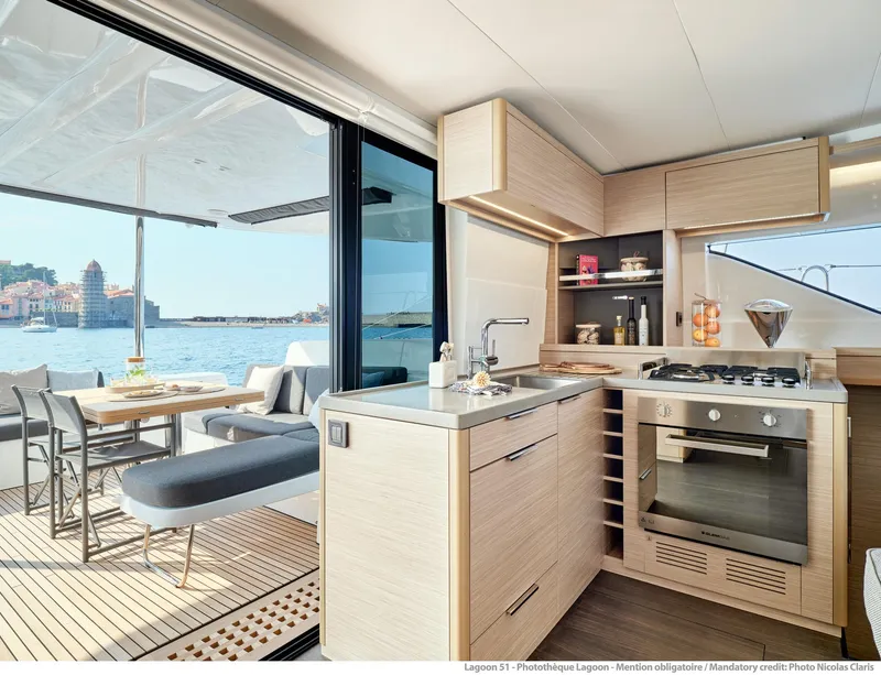 Slide: The Image of Modern kitchen interior of 2025 Lagoon 51 ICONIC yacht with ocean view. - 28