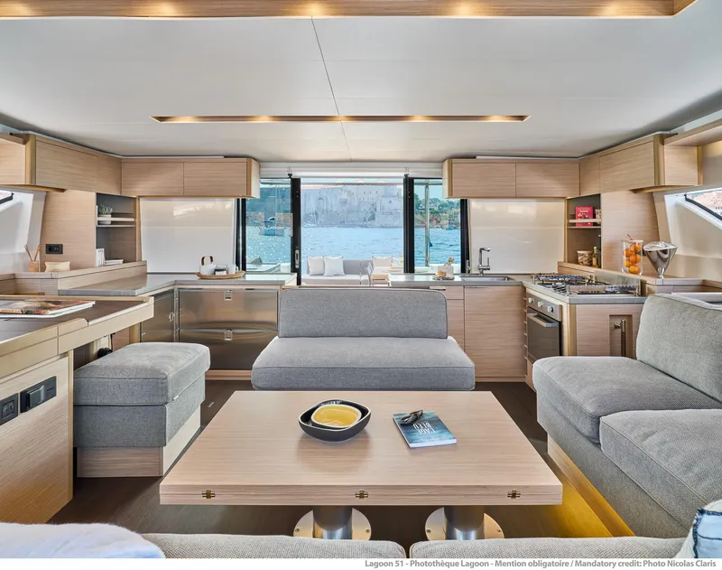 Slide: The Image of Luxurious interior of 2025 Lagoon 51 ICONIC yacht with modern kitchen and seating area. - 33