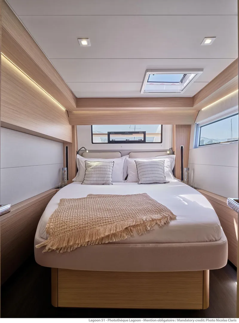 Slide: The Image of Luxurious bedroom interior of 2025 Lagoon 51 ICONIC yacht with modern design and natural light. - 39