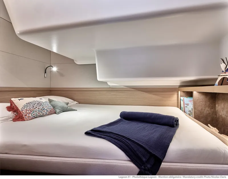 Slide: The Image of Luxurious interior cabin of 2025 Lagoon 51 ICONIC yacht with modern bedding. - 42