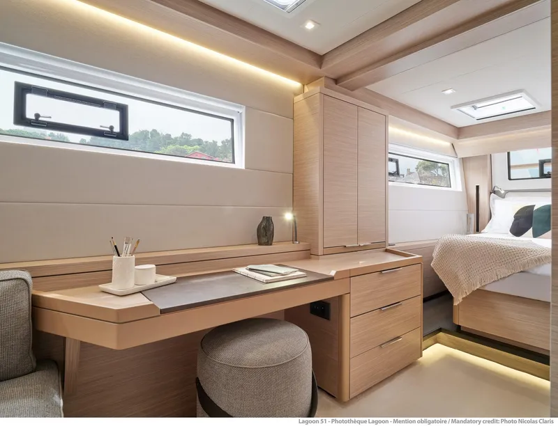 Slide: The Image of Luxurious interior of 2025 Lagoon 51 ICONIC yacht with modern furnishings and natural light. - 45