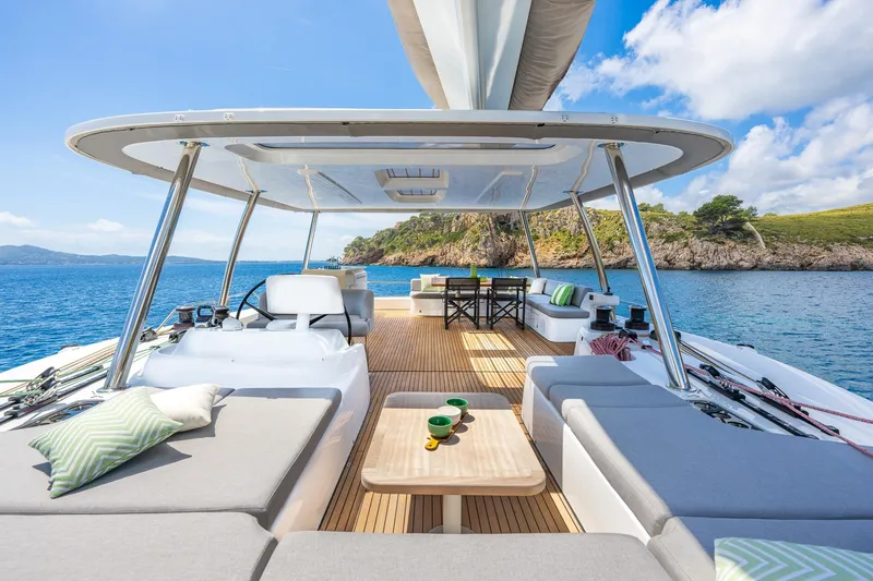 Slide: The Image of Luxurious Lagoon 60 yacht deck, 2025 model, with elegant seating and ocean view. - 19