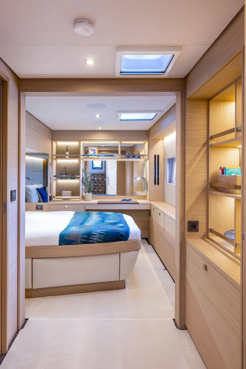 Slide: The Image of Luxurious interior of 2025 Lagoon 60 yacht with modern bedroom design. - 33