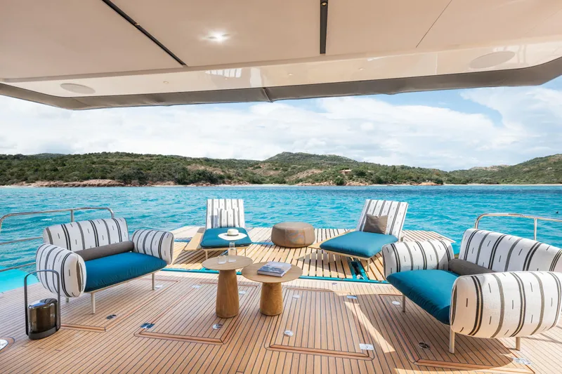 Slide: The Image of Luxurious Lagoon Eighty 2 yacht deck with stylish seating, overlooking serene blue waters, 2025 model. - 14
