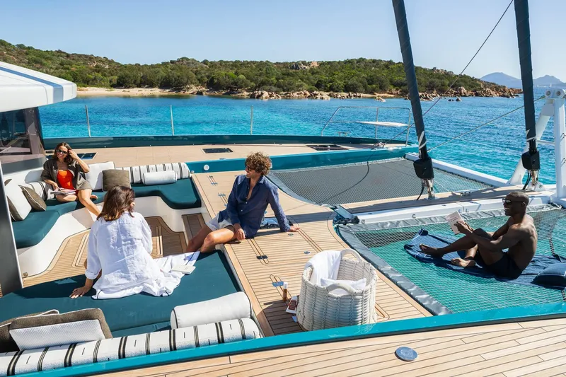 Slide: The Image of People relaxing on Lagoon Eighty 2 yacht, 2026, with scenic ocean view. - 24