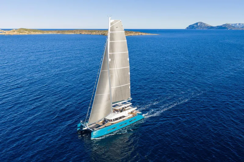 Slide: The Image of Sailing Lagoon Eighty 2 catamaran on open sea, 2026 model, clear blue waters. - 3