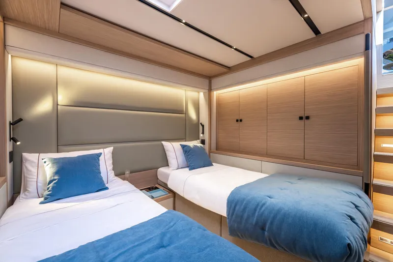 Slide: The Image of Luxurious cabin interior of 2025 Lagoon Eighty 2 yacht with twin beds and modern design. - 45