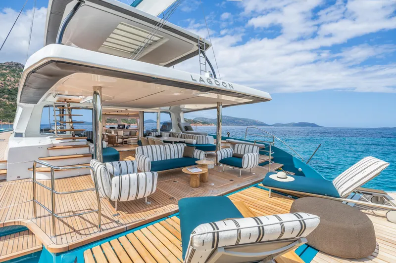 Slide: The Image of Luxurious 2025 Lagoon Eighty 2 yacht with elegant deck seating and stunning ocean views. - 8