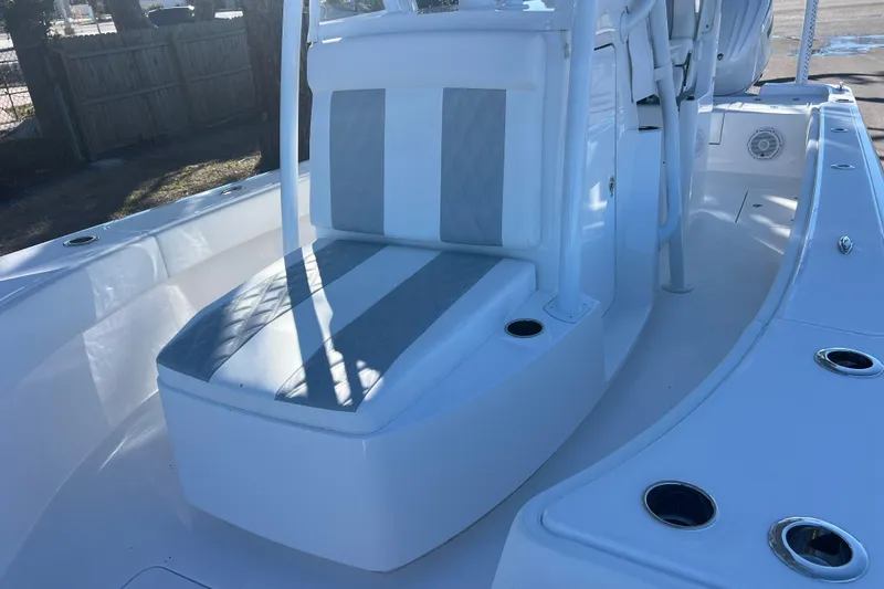 Slide: The Image of 2026 Contender 29 Bay boat interior with dual seats and steering wheel. - 19