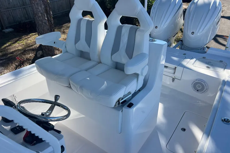 Slide: The Image of 2026 Contender 29 Bay boat compartment with visible wiring and components. - 22