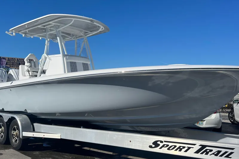 Slide: The Image of 2026 Contender 29 Bay boat on trailer, featuring Yamaha outboard engines. - 3